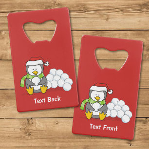 Christmas penguin sitting with snow balls