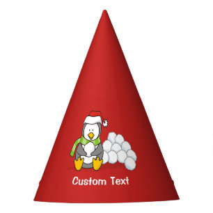 Christmas penguin sitting with snow balls party hat