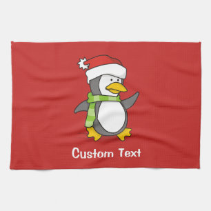Christmas penguin walking on snow tea towel