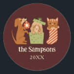 Christmas Pets Red Classic Round Sticker<br><div class="desc">Cute and festive Christmas favour sticker featuring hand drawn illustration of cats and dogs in holiday theme. The background is red.</div>
