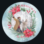 Christmas photo family floral wreath classic round sticker<br><div class="desc">Christmas photo stickers with red green floral wreath with poinsettia,  snowy background,  your own photo and personalised text.</div>