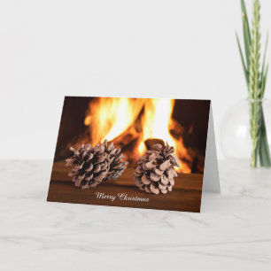 Christmas pine cones by fireplace card