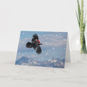 Christmas raven soaring over snowy mountains card