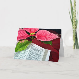 Christmas red poinsettia flower on Bible Holiday Card