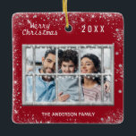 Christmas red white family photo winter window ceramic ornament<br><div class="desc">A classic dark red Christmas style background colour,  decorated with faux glitter.The text: Merry Christmas with a white hand lettered style font,  letters.  Personalise and add your own family photo and family name,  year. A winter window overlay over the photo.</div>