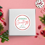 Christmas Round Sticker Red Script Personalised<br><div class="desc">Complete your Christmas gifts and envelopes this year with a personalised Christmas label. This Season's Greetings round sticker includes a modern red and green holiday design with stylish script font and faux red foil effect.</div>