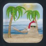 Christmas Sandman On Tropical Beach Paper Plate<br><div class="desc">Cute sandman wearing a Santa Claus hat and sunglasses on beach sand with holiday lights in palm trees and hammock.</div>