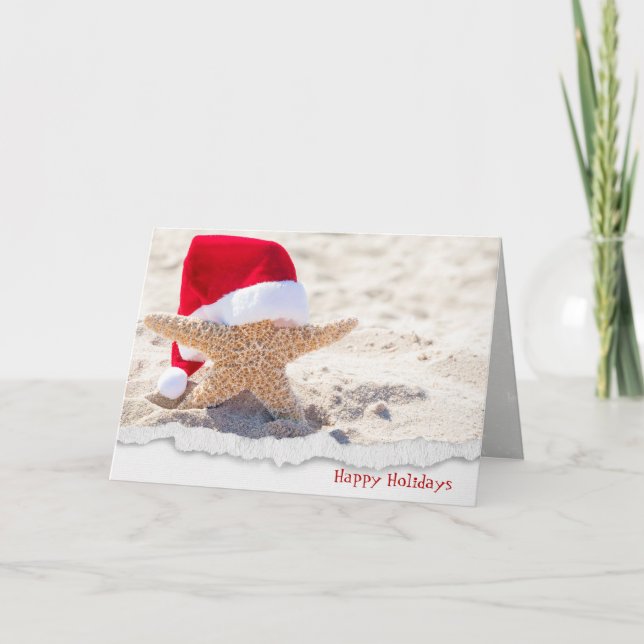 Christmas Santa hat on starfish in sand Holiday Card (Front)