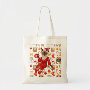 Christmas Siamese Cat is celebrating at home Tote Bag