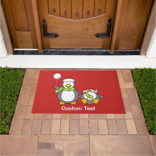 Christmas Snowballing penguins Doormat