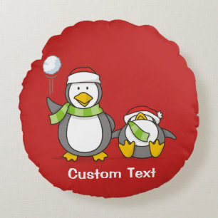 Christmas Snowballing penguins Round Cushion