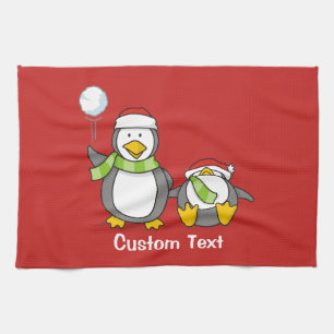 Christmas Snowballing penguins Tea Towel