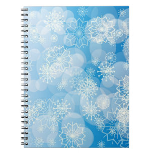 Christmas snowflakes on a blue background notebook