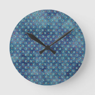 Christmas snowflakes on a blue background round clock
