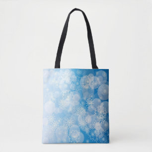 Christmas snowflakes on a blue background tote bag