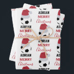 Christmas Soccer Ball Sports Football Custom Name Wrapping Paper Sheet<br><div class="desc">A cute illustration of soccer ball wearing a Santa hat with words "Merry Christmas" and your custom name. Perfect for adults and kids who love playing football. An ideal soccer themed Christmas wrapping paper for soccer players, soccer coaches, soccer teams, athletes and soccer enthusiasts. Simply customise the name and make...</div>