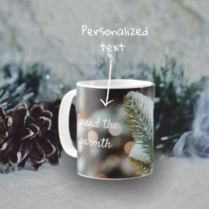 Christmas spruce branch and winter lights coffee mug