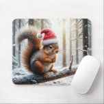 Christmas Squirrel On Snowy Tree Branch Mouse Mat<br><div class="desc">A squirrel wearing a Santa hat is perched on a snow-covered branch in a wintry forest,  with sunlight filtering through the trees</div>