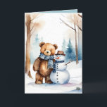 Christmas Teddy Bear And Snowman Holiday Card<br><div class="desc">Cute watercolor brown teddy bear in winter woods with snowman.
Text is editable.</div>