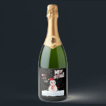 Christmas The Snowman Sparkling Wine Label<br><div class="desc">These sparkling wine labels showcase the words "Merry Christmas Ho Ho Ho" in a unique print font with multi-coloured letters and Christmas The Snowman wear red and white with snow falling in the background in this X-mas theme and style. All labels are printed with photo-quality printing great for customising weddings,...</div>
