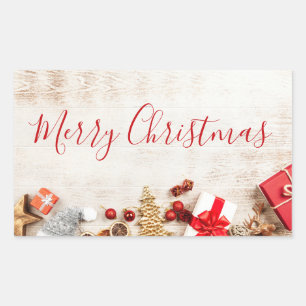 Christmas Themed Items on a Rustic Wooden Board Rectangular Sticker