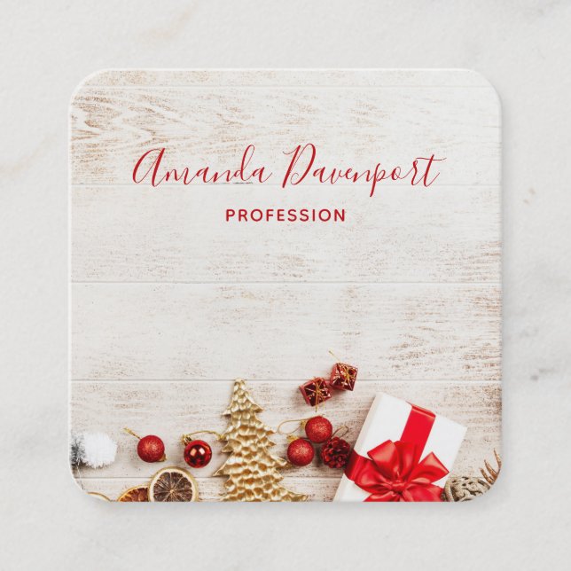 Christmas Themed Items on a Rustic Wooden Board Square Business Card (Front)