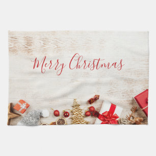 Christmas Themed Items on a Rustic Wooden Board Tea Towel