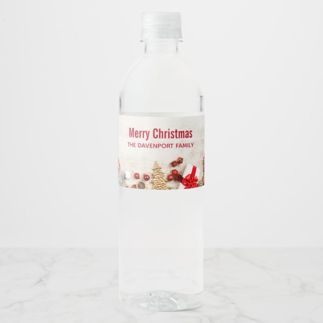 Christmas Themed Items on a Rustic Wooden Board Water Bottle Label (Front)