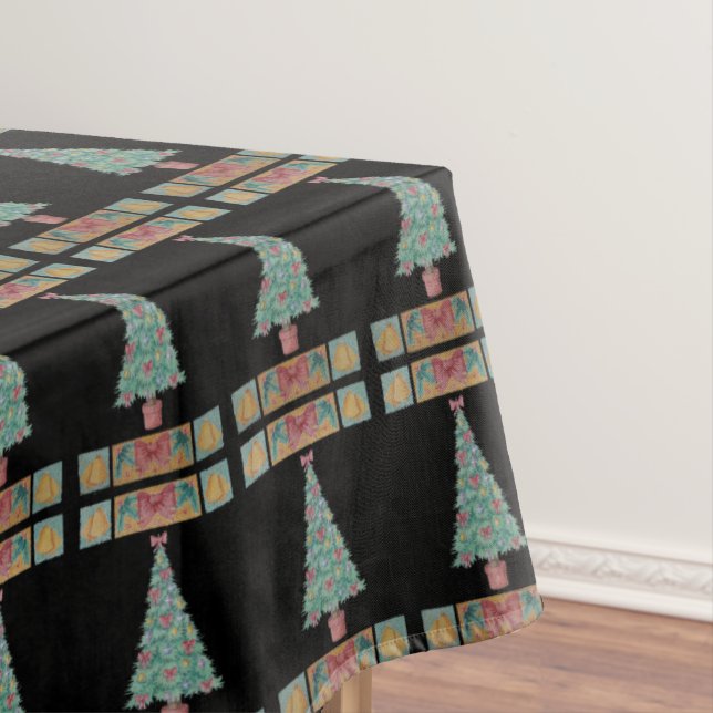 Christmas tree decorations red bow bells black tablecloth (In Situ)
