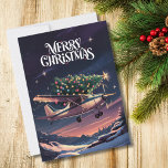 Christmas Tree on Cessna Aeroplane Photo Funny Holiday Card<br><div class="desc">A funny vintage style Christmas card with a Cessna 172 aeroplane flying through a star-filled sky, with a fully decorated Christmas tree strapped to its top. Set against rich indigo and amethyst hues with illuminated snowdrifts below, the design features the festive greeting "Merry Christmas" in white font above. The inside...</div>