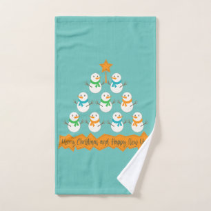 Christmas tree pyramid made of xmas snowmen hand towel