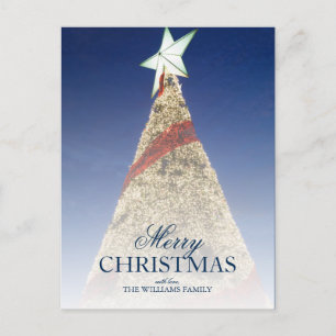 Christmas tree with birght white star at top holiday postcard