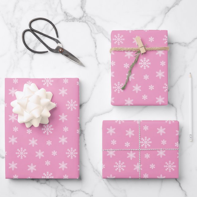 Christmas white snowflakes on pink background wrapping paper sheet (Front)