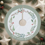 Christmas Winter Berries Wreath Custom Family Name Brushed Polyester Tree Skirt<br><div class="desc">Custom-designed Christmas tree skirt featuring personalised family name encircled in an elegant watercolor Christmas wreath with winter greenery and red berries.</div>