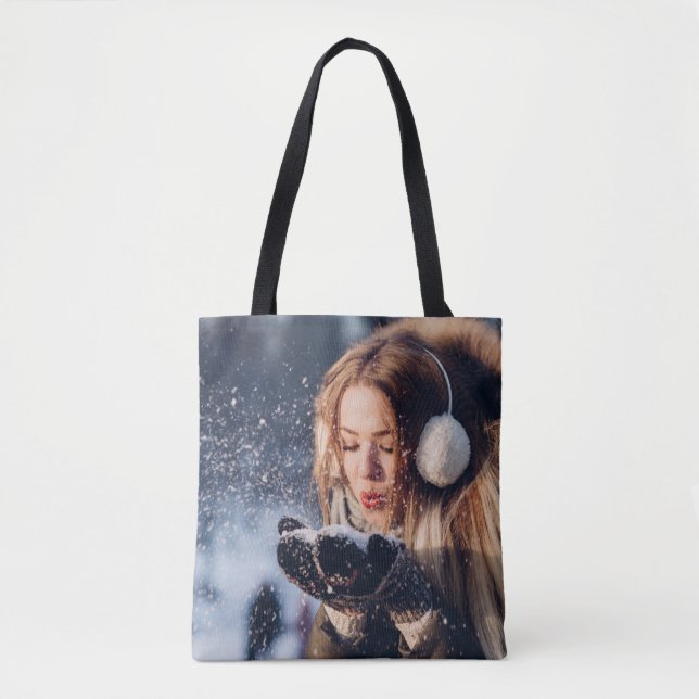 Christmas Winter Girl blowing snow in Her Hand Tote Bag (Front)
