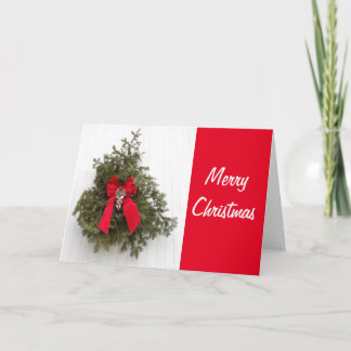 Christmas Wreath and Bow on a Red Barn for Xmas Card