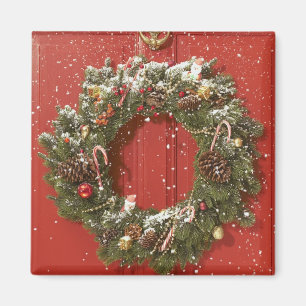 Christmas wreath hanging on a door magnet