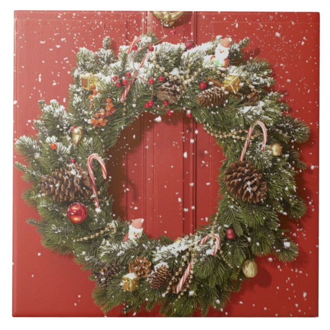 Christmas wreath hanging on a door tile (Front)