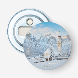 Church covered in snow with mountain background bottle opener
