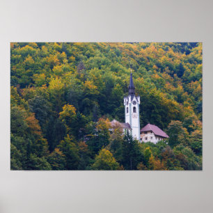 Church in a fall forest in Slovenia Poster