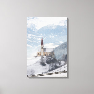 Church in an alpine winter landscape canvas print
