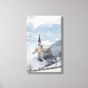 Church in an alpine winter landscape canvas print