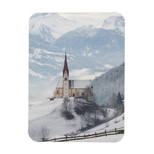 Church in an alpine winter landscape magnet