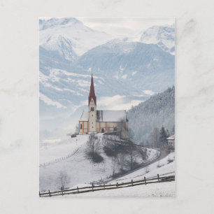 Church in an alpine winter landscape postcard