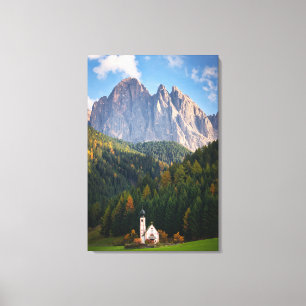 Church in front of Dolomites mountains in Italy Canvas Print