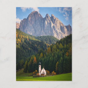 Church in front of Dolomites mountains in Italy Postcard