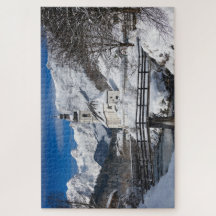 Church in the snow with Alps mountains