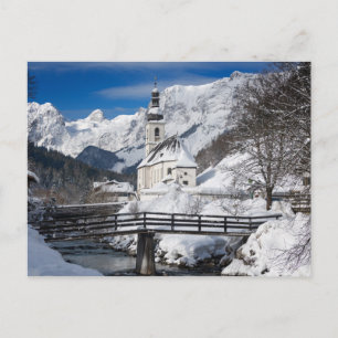 Church in the snow with Alps mountains Postcard