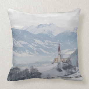 Church in Zillertal in winter throw pillow