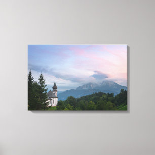 Church with Alps mountains at sunset Canvas Print